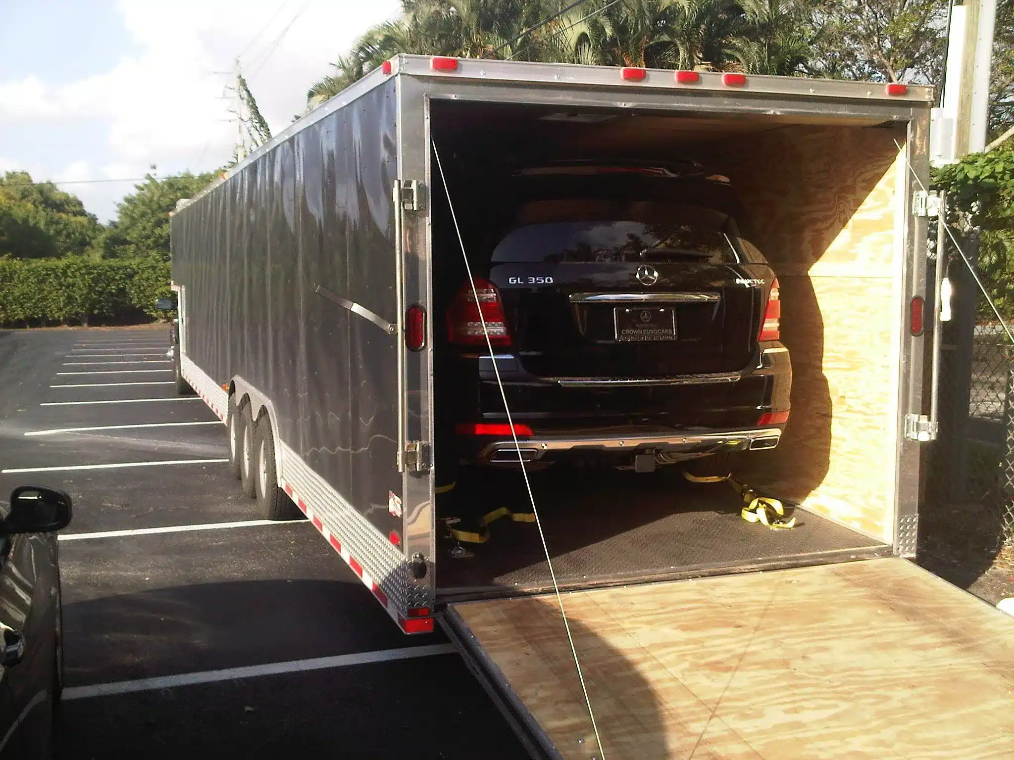Porsche loading into an enclosed car transport trailer in Dallas